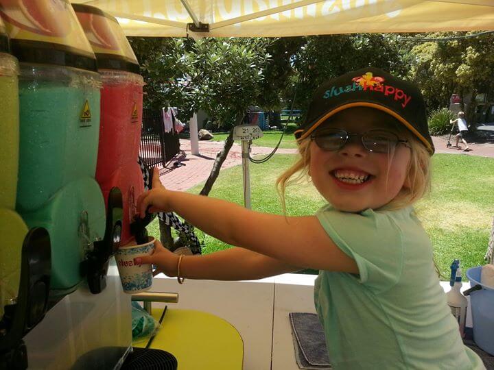 A cute girl is taking her slushy - slushhapy